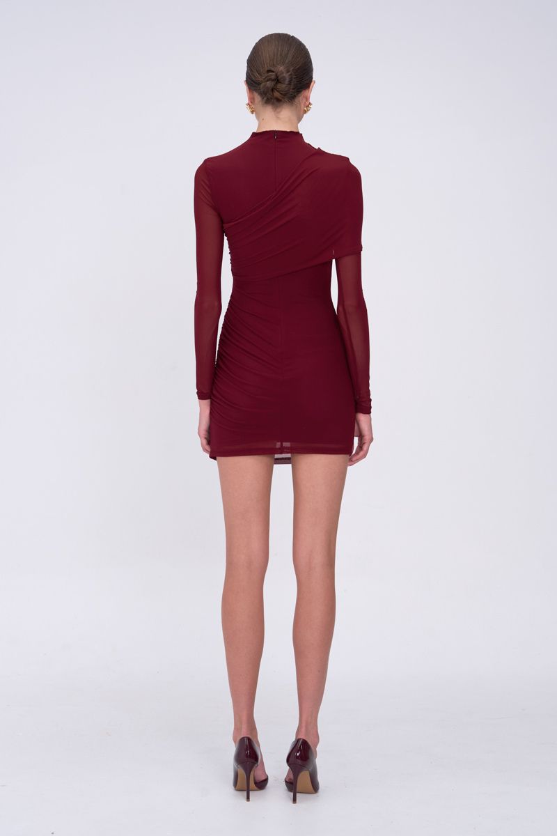 Burgundy dress worn by a model on a white background