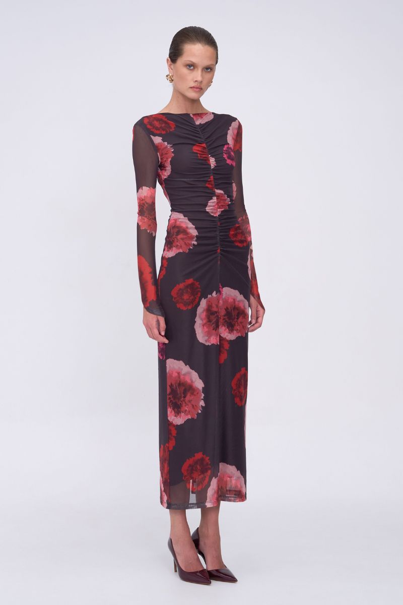 Woman wearing a floral dress on a white background