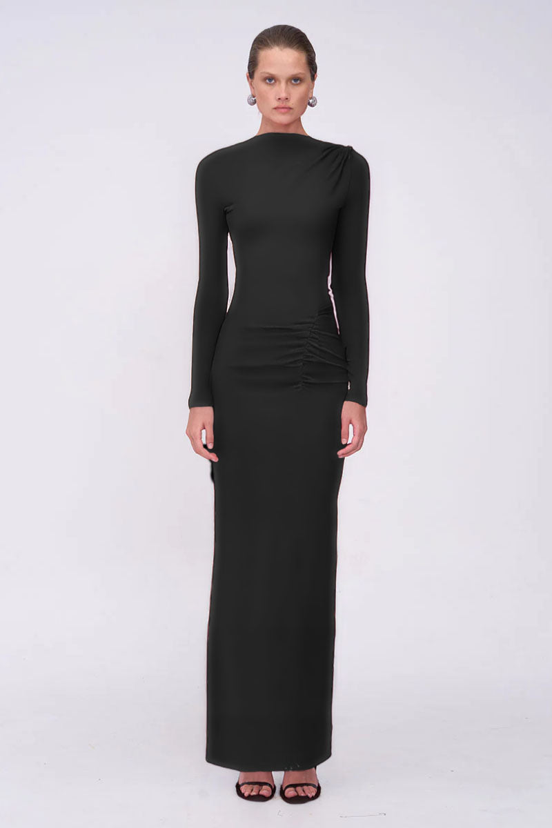 Woman wearing a black long-sleeve dress on a white background