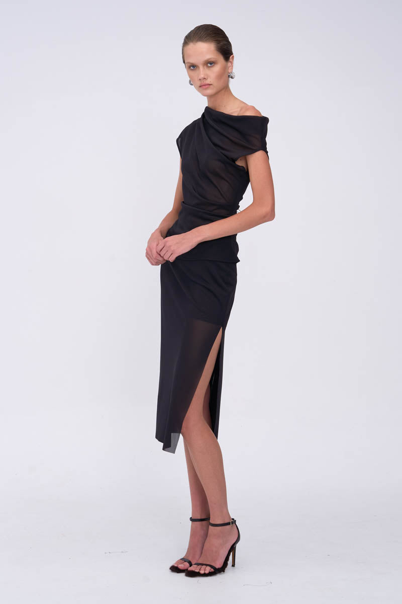 Woman wearing a black one-shoulder top with matching skirt