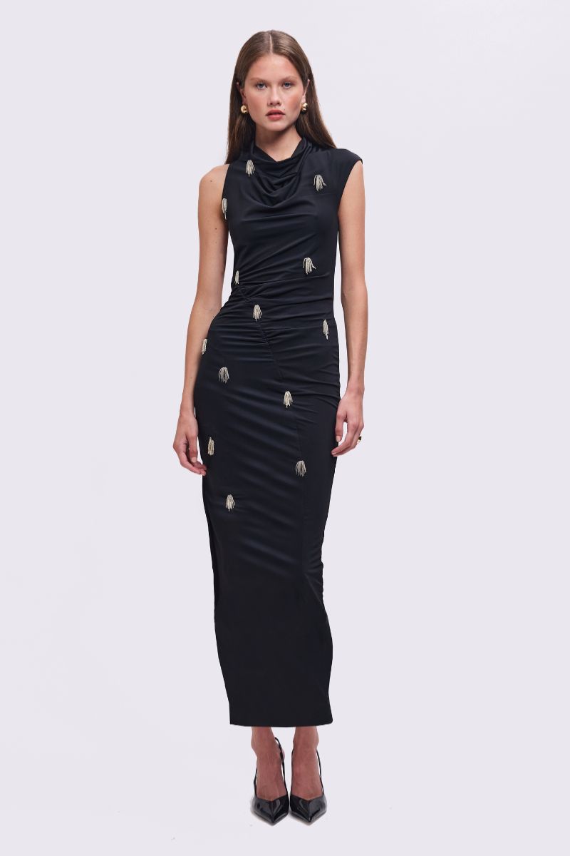 Black dress with embellishments on a white background