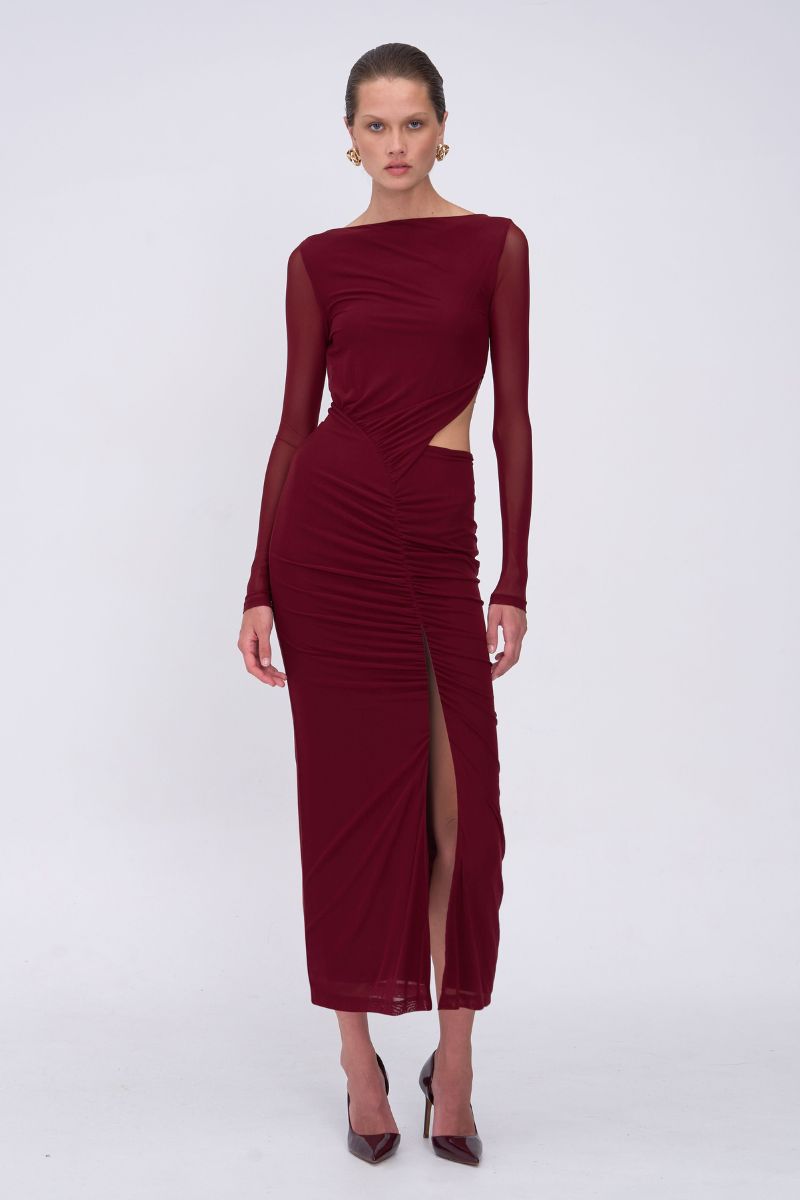 Burgundy dress with cut-out design and slit on a white background
